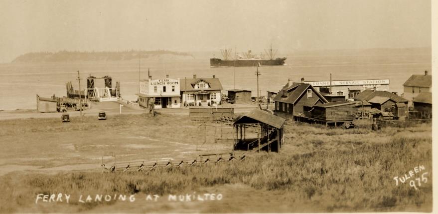 August 1932 photo shows location of ballfield with grandstand, bleachers, and muddy field near ferry landing, Ferry Lunch, Howard Josh house and Victor McConnell's house