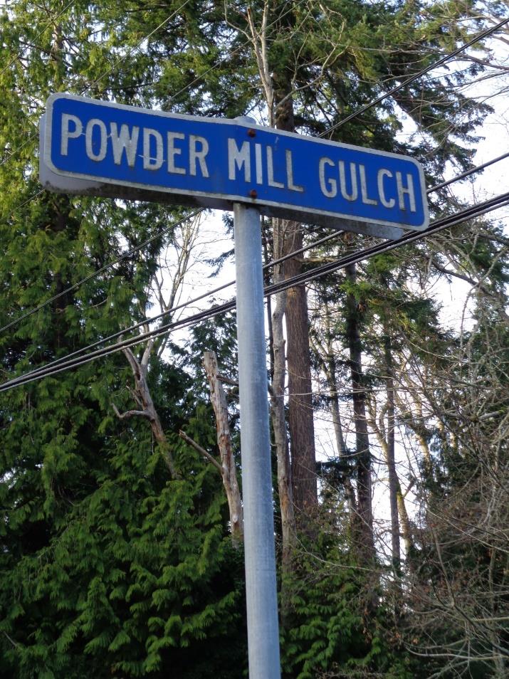 Street sign on Mukilteo Boulevard marking the location of Powder Mill Gulch